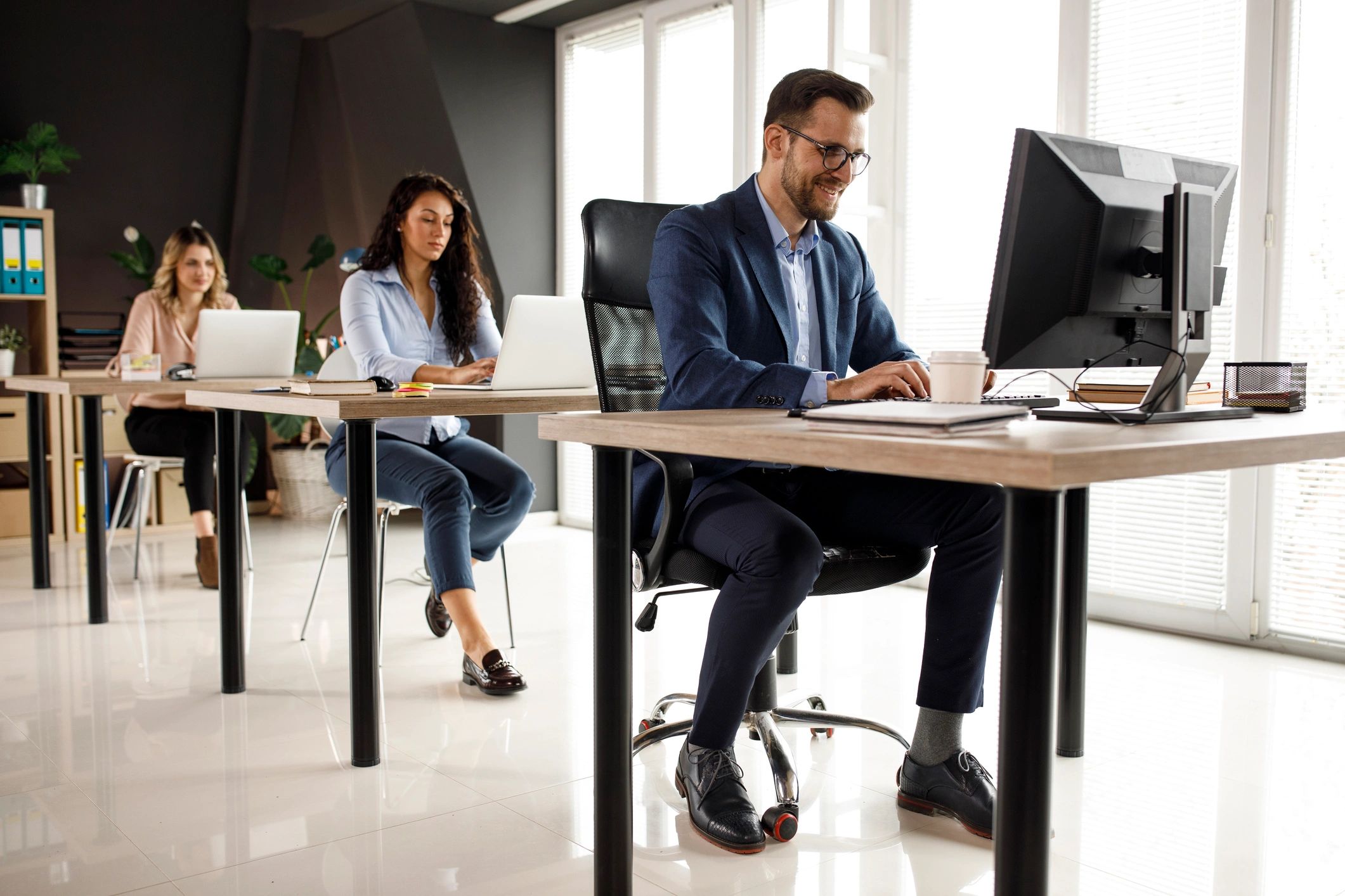 Operations staff monitoring systems across multiple workstations