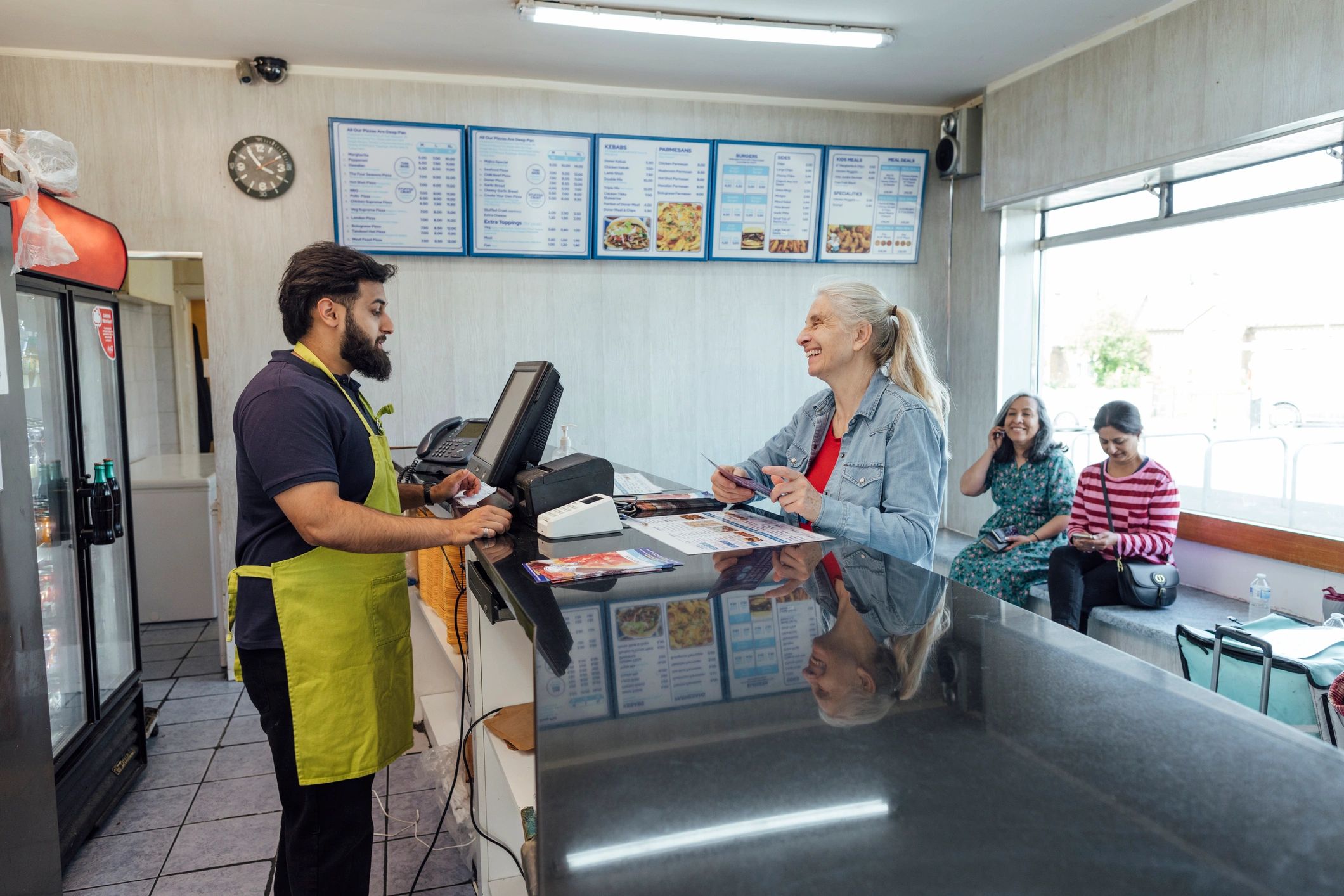 Retail team member at a store counter