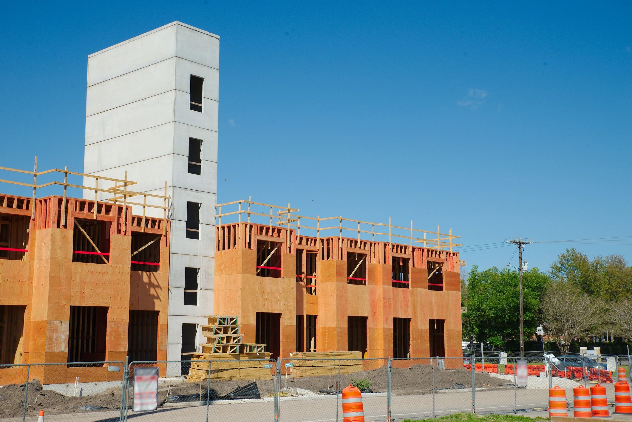 Building construction site with framing and concrete core