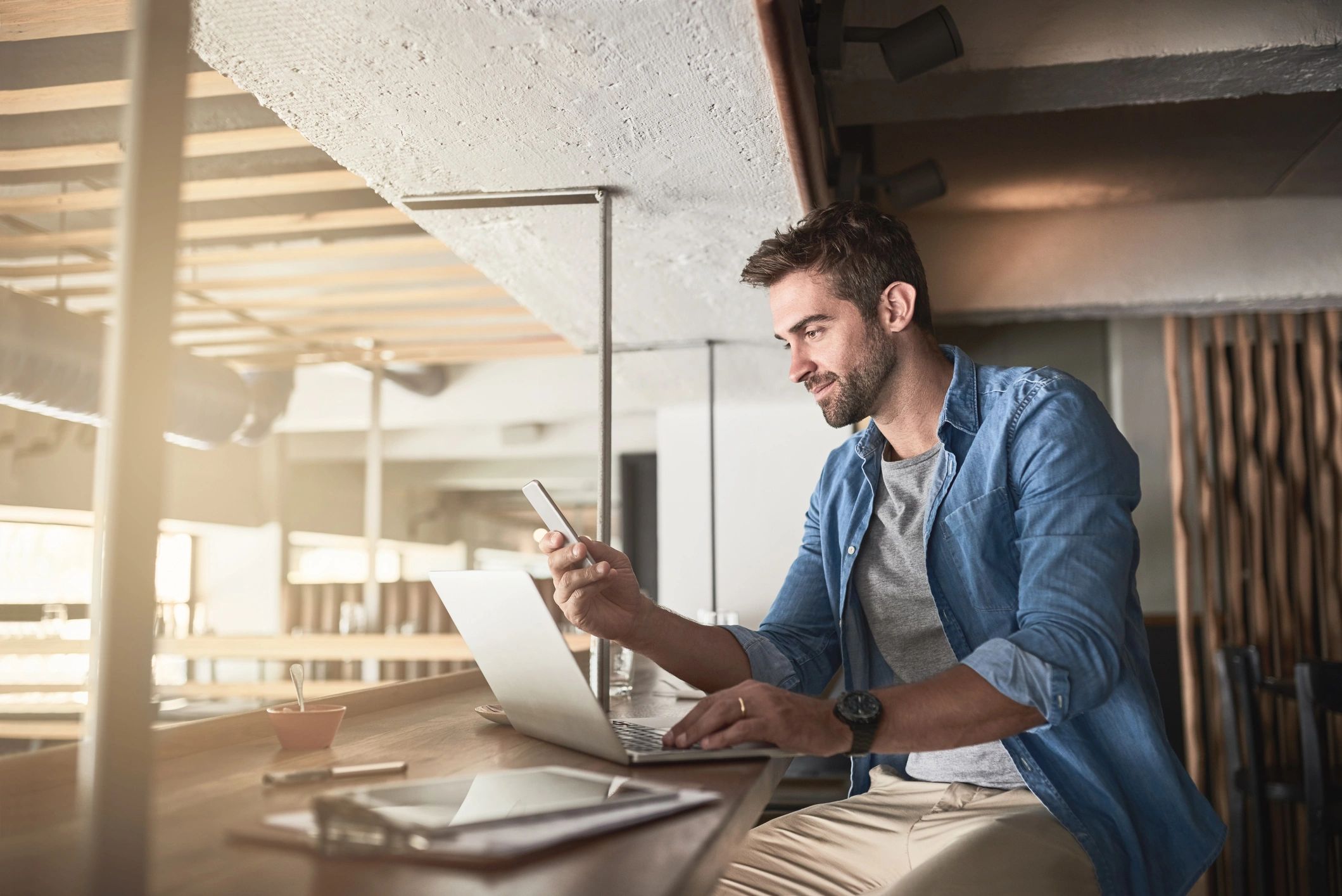 Professional using laptop in a work setting